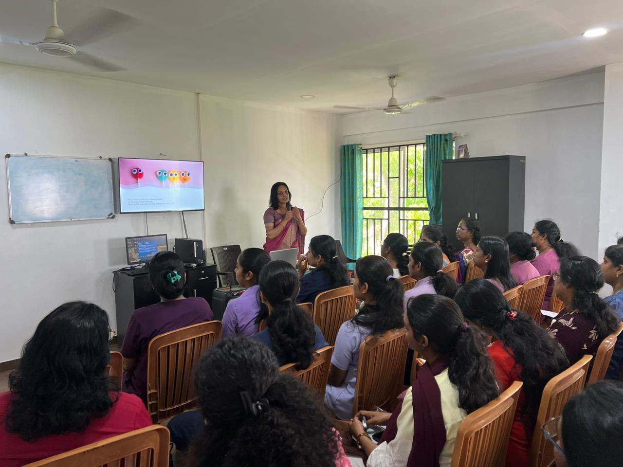 Hema R Iyer delivering an authoritative keynote speech on DEI and POSH compliance to a large corporate audience
